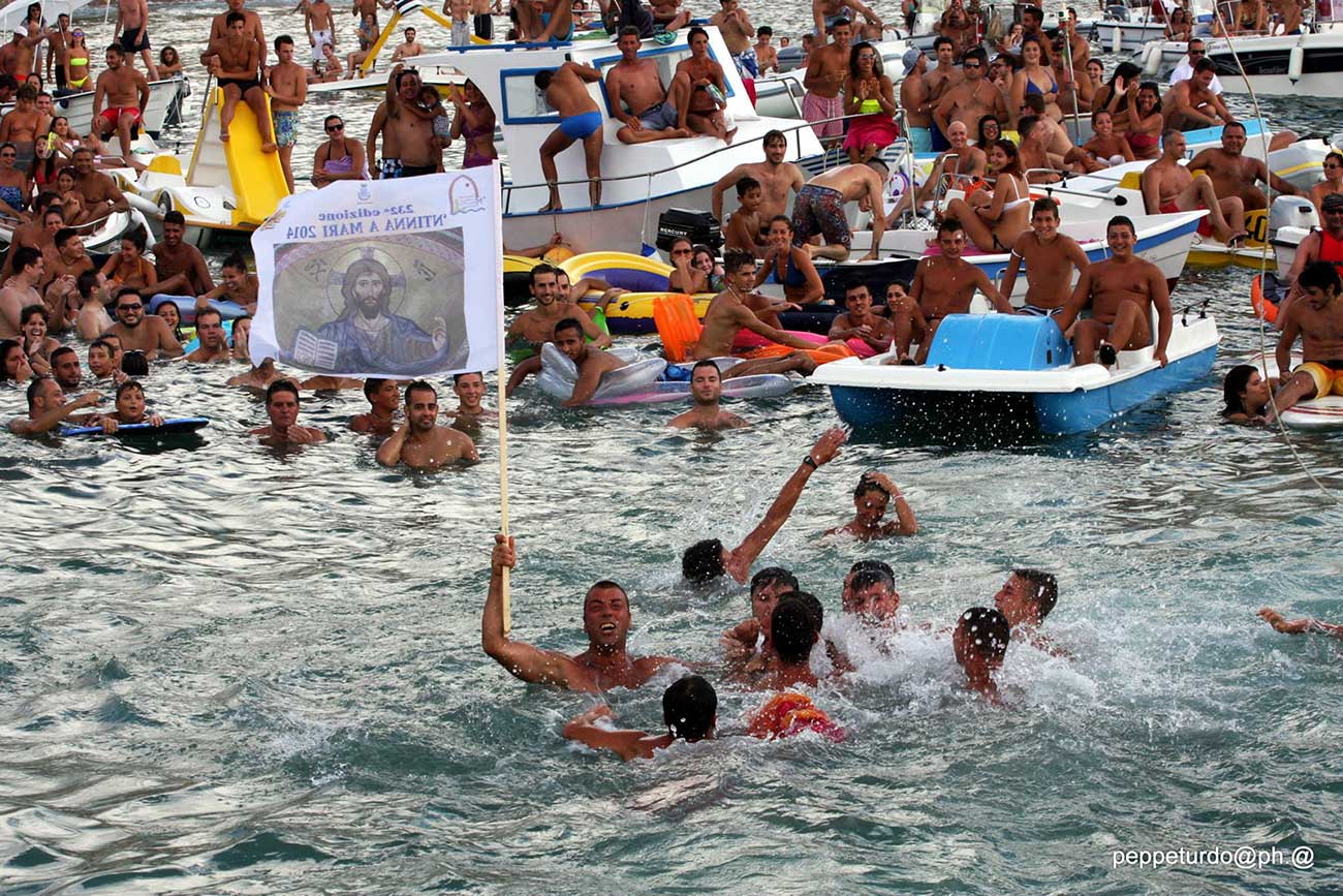 Fisherman victory after taking the flag depicting the image of Jesus